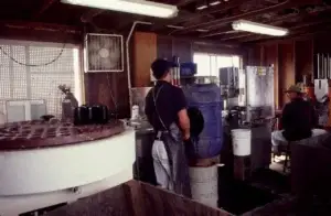 Historic photo of winery workers at the bottling line