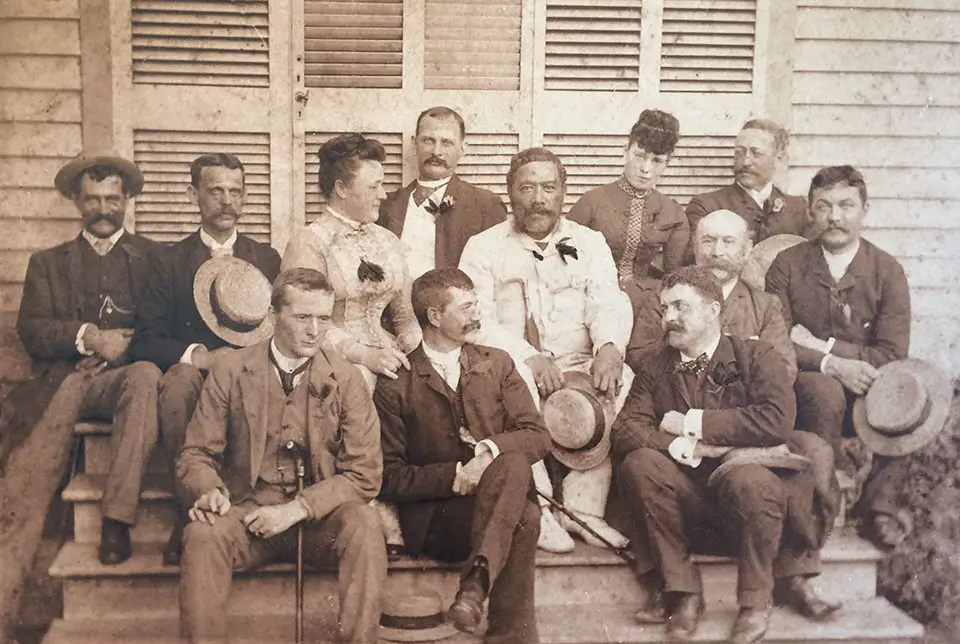 Historic group photo of the Poker Club on the steps at Rose Ranch